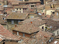 Sienese rooftops feature appropriately-colored satellite dishes